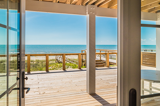 Enjoy fresh coastal air from your custom Carolina Beach home.